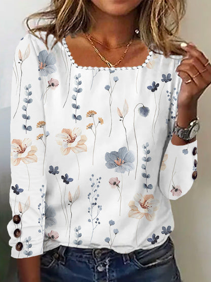 Damen Bluse mit floralem Druck und dekorativen Knopfdetails in Weiß