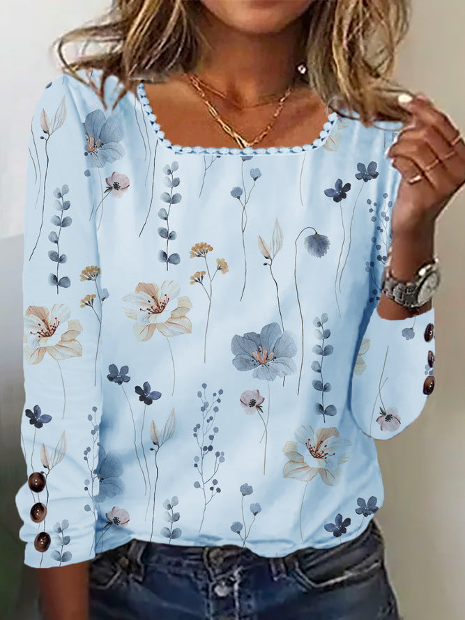 Damen Bluse mit floralem Druck und dekorativen Knopfdetails in Hellblau