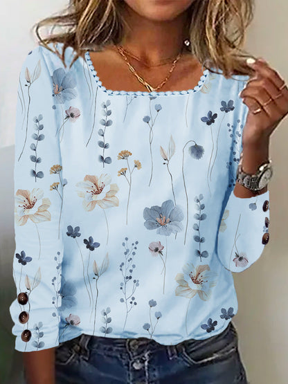 Damen Bluse mit floralem Druck und dekorativen Knopfdetails in Hellblau