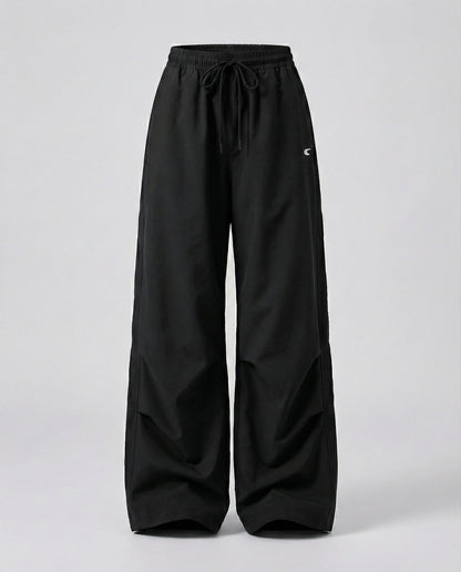 Damen weite Bundhose mit elastischem Tunnelzug langen Schlagbeinen und seitlicher Teilungsnaht in Schwarz