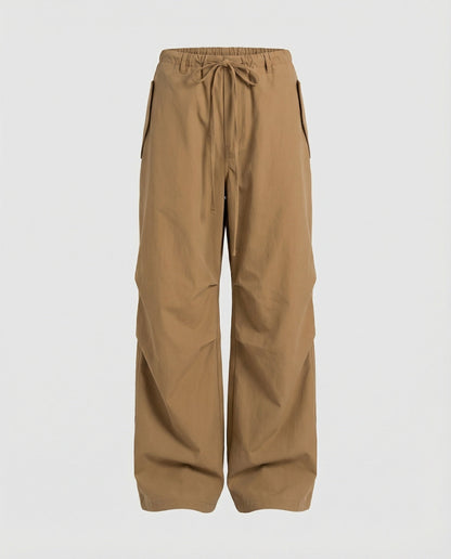 Damen hochgeschnittene extraweite Streetwear-Hose mit Tunnelzugbund, markanten Kniefalten und weitem Beinverlauf in Schwarz