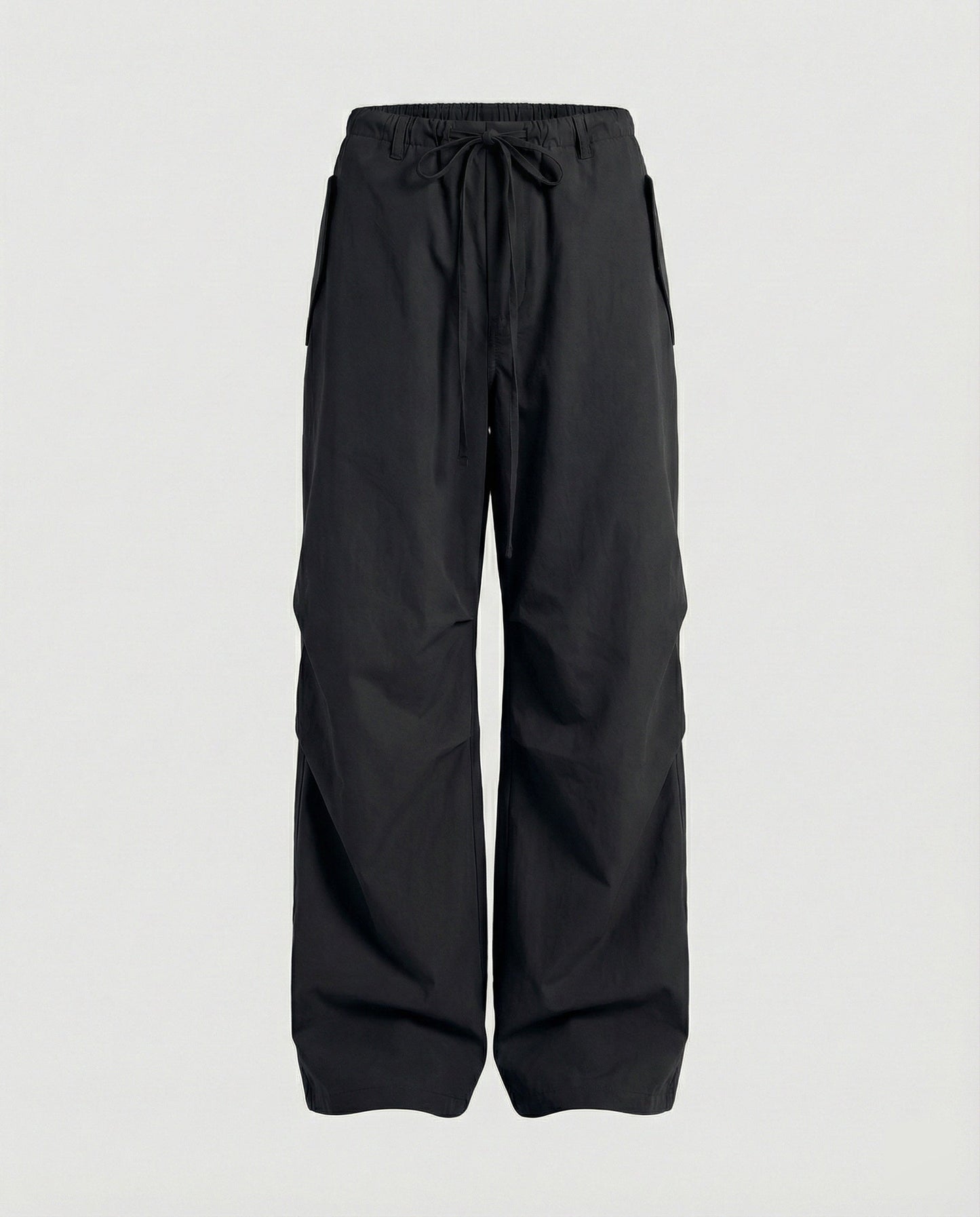 Damen hochgeschnittene extraweite Streetwear-Hose mit Tunnelzugbund, markanten Kniefalten und weitem Beinverlauf in Schwarz