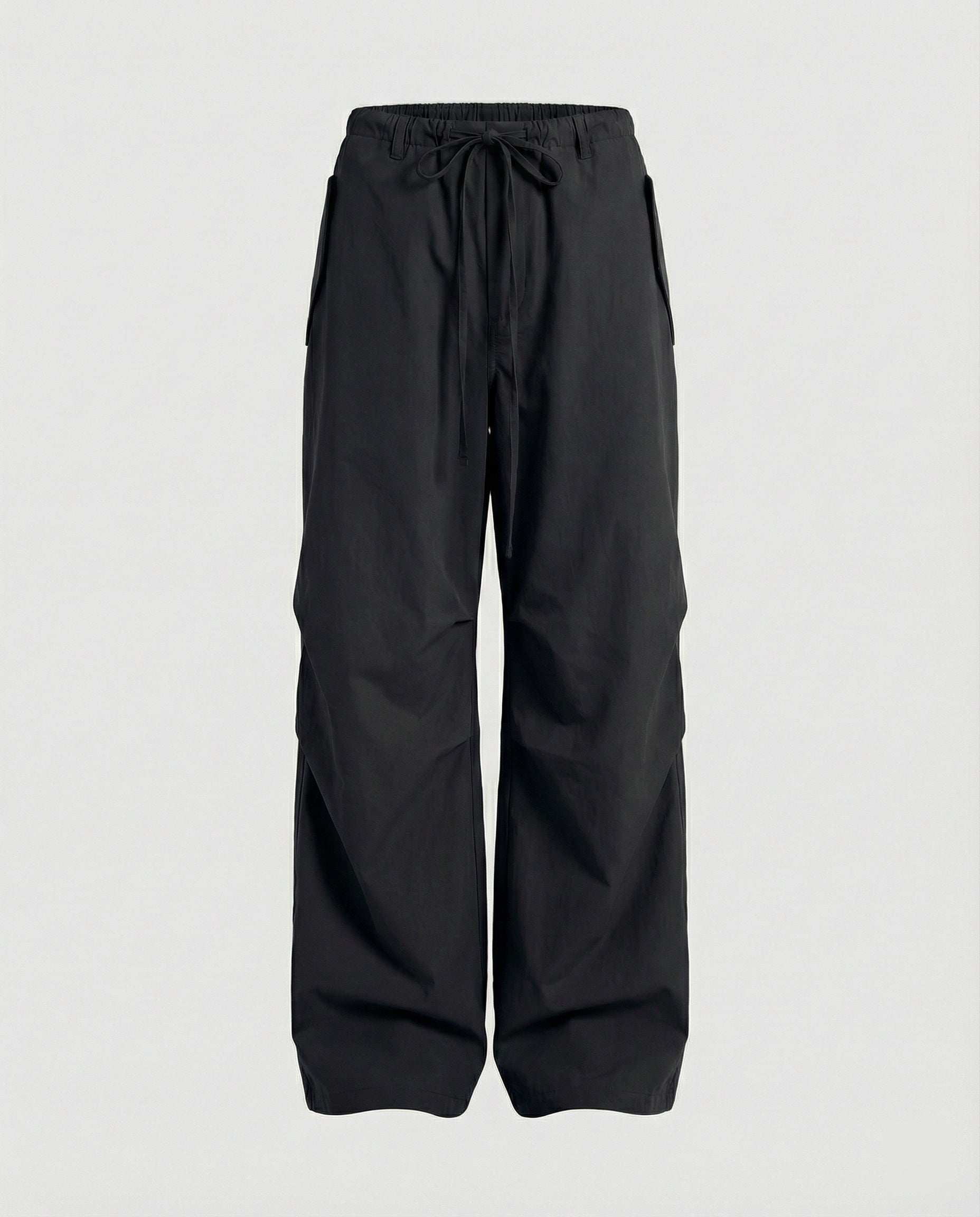 Damen hochgeschnittene extraweite Streetwear-Hose mit Tunnelzugbund, markanten Kniefalten und weitem Beinverlauf in Schwarz